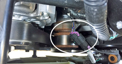 Wiring harness above water pump in '13-'18 Dodge Cummins trucks.